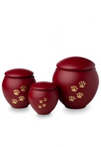 Dierenurn met goudkleurige dierenpootjes rood